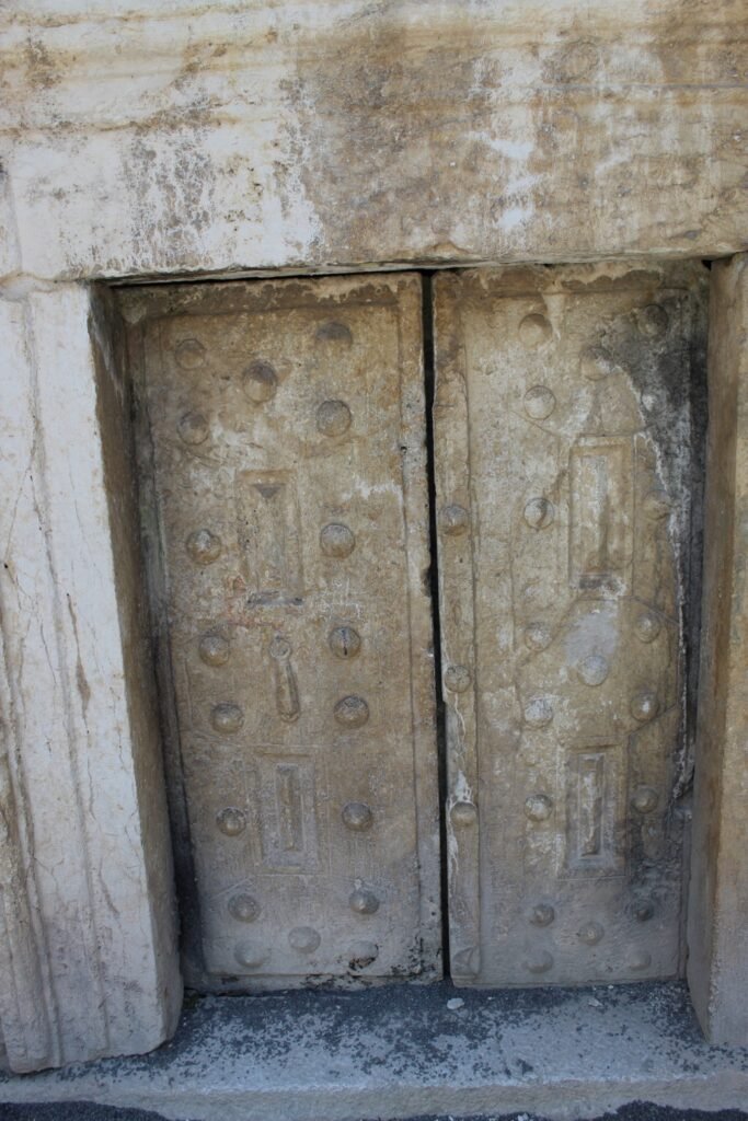 A stone sealing a tomb entrance