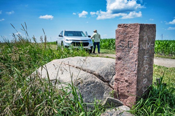 Stone boundary markers in a quiet field