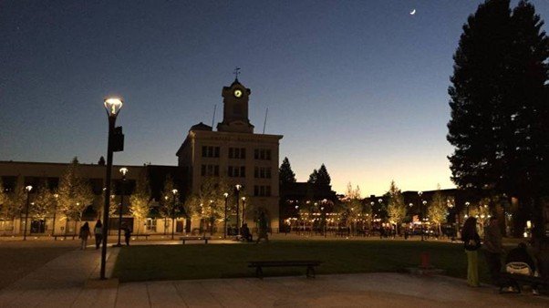 A quiet city square in early light