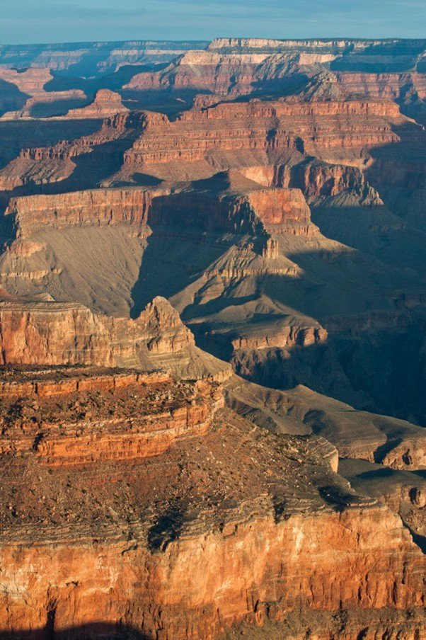 Massive canyon walls showing visible horizontal rock strata layers.
