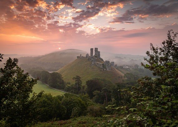 41 Guided in the Shadows Weathered stone ruins on a hilltop overlooking countryside.