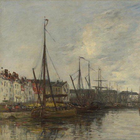 Concrete harbour quay with mooring bollards beside calm water under an overcast sky.