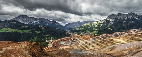 Large terraced quarry descending into a deep pit.