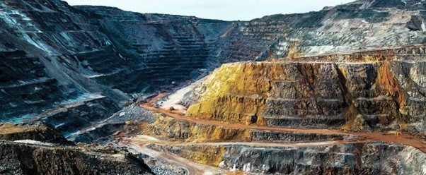 Stepped quarry terraces cut into exposed stone hillside.